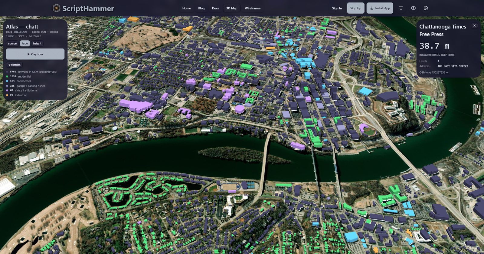 The live /chatt atlas: about 8,000 Chattanooga buildings shaded by type over aerial imagery, with the Tennessee River curving through and a pop-up reading 38.7 meters of measured lidar height for one downtown building